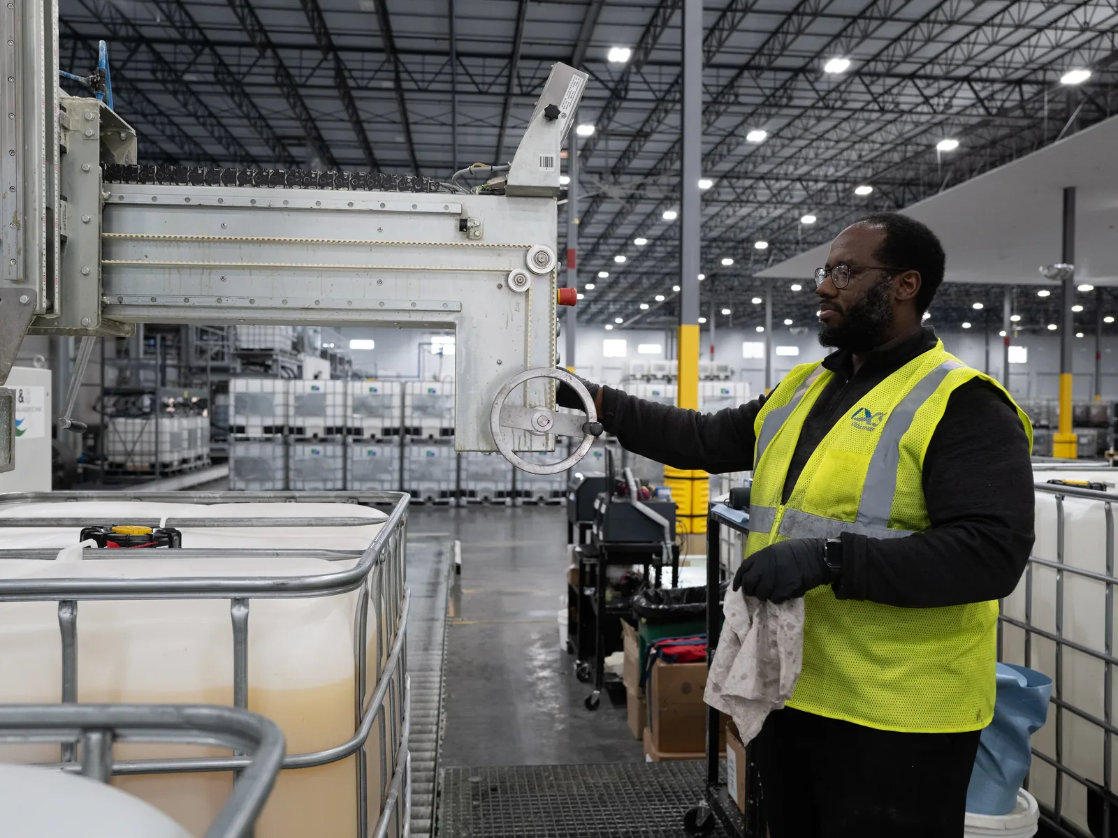 Technician operating manufacturing equipment at the Ultimate Linings facility in Lebanon, Tennessee