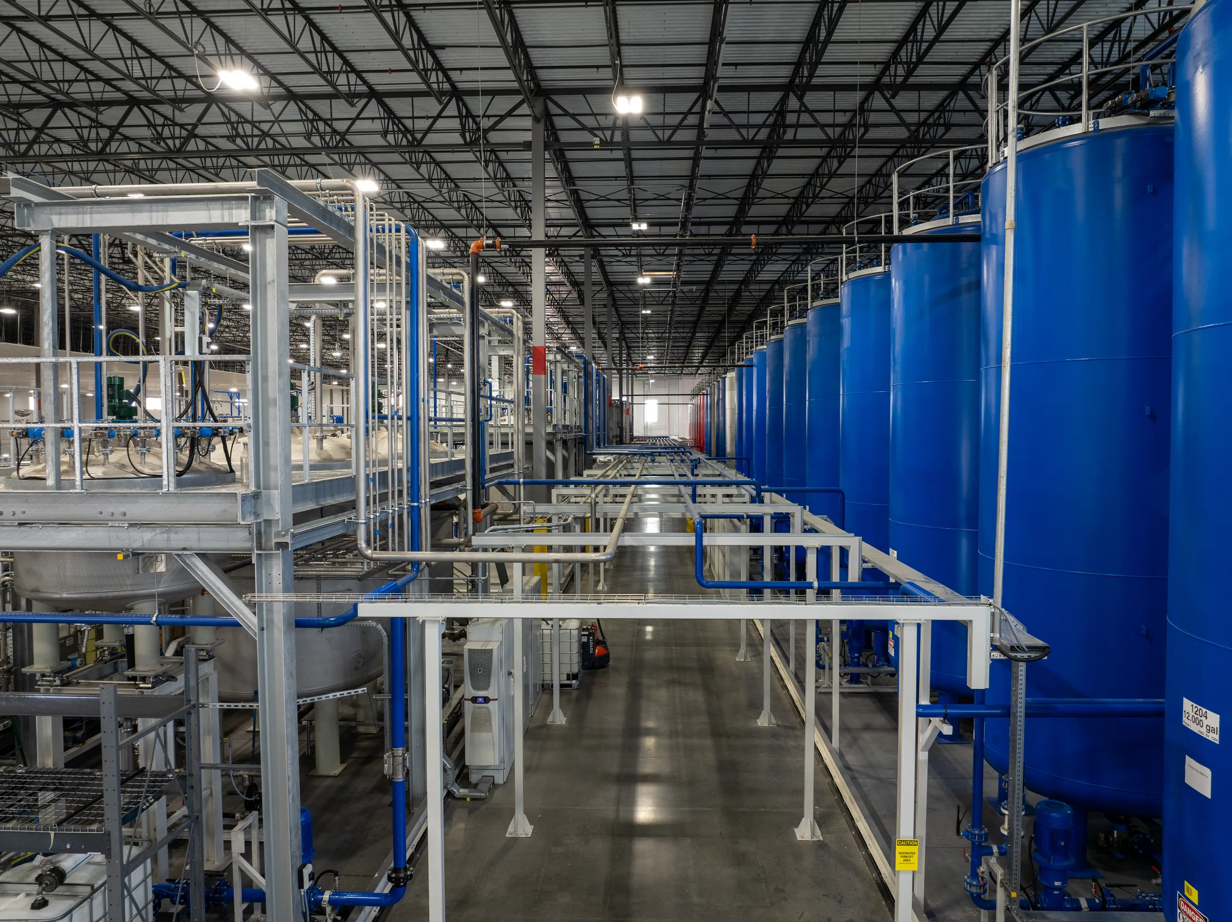 Interior of the Ultimate Linings polyurea manufacturing facility in Lebanon, Tennessee, showing production tanks and piping
